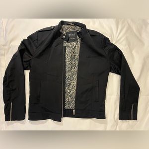 Zara men’s light jacket, black with animal print lining.